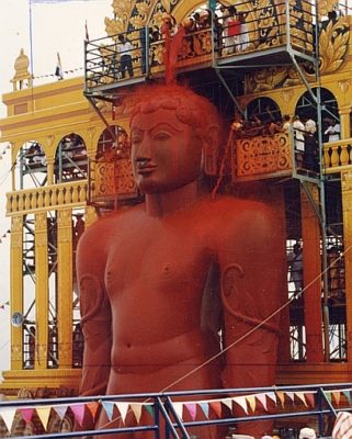 Statue of Bāhubali anointed with red