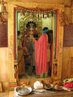 Women and an idol in the temple