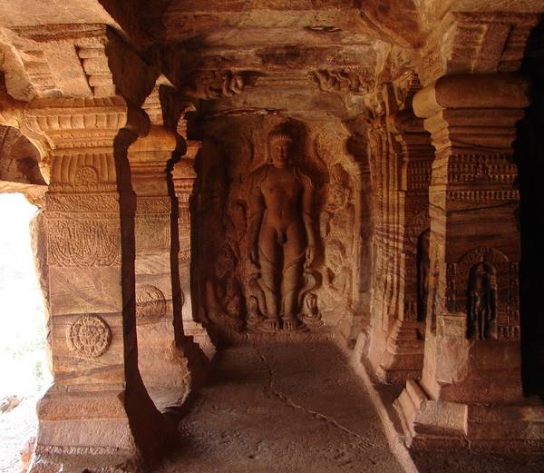 Sculpture of the Jain saint Bāhubali in the cave temple at Badami. Only one of the four temples here is Jain but it features intricately carved pillars and numerous Jinas carved in relief inside. The main image is of the 24th Jina Mahāvīra.