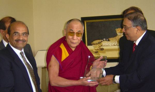 The Dalai Lama accepts his Ahimsa Award 2007 from directors of the Institute of Jainology in London.