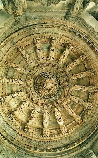 The intricately carved dome of the Lūṇa Vasahi at Mount Abu in Rajasthan. Dedicated to the 22nd Jina, Nemi, the temple was built by Tejaḥpāla in 1232 CE. The marble ceiling features the 16 vidyā-devīs – goddesses of magical knowledge – in a circle.