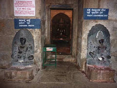 Sarvānubhūti and Kūṣmāṇḍinī at the entrance of a temple on Candra-giri, Shravana Belgola. These deities are considered the model for the later standard pairing of yakṣa and yakṣī. Each of the 24 Jinas has a pair of these deities to guard his teachings.
