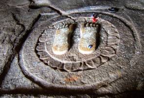 Sacred footprints in Bhadrabāhu’s Cave on Candra-giri at the pilgrimage site of Shravana Belgola, Karnataka. These footprints – caraṇa – are considered to be those of the 3rd-century sage Bhadrabāhu, who fasted to death at Shravana Belgola