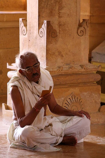 A man reads a prayer aloud in a temple in Jaisalmer, Rajasthan. Jains may perform mental worship – bhava-pūjā – which includes singing hymns, reciting mantras and meditating. All Jain prayers are praises of the Jinas and other holy figures.