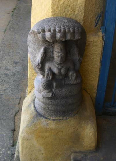 Sculpture of Padmāvatī on a temple column at Tirupannamur, Tamil Nadu. The goddess Padmāvatī is immediately identifiable from the characteristic snakehoods above her head. A powerful and popular deity, she is especially favoured in south India.