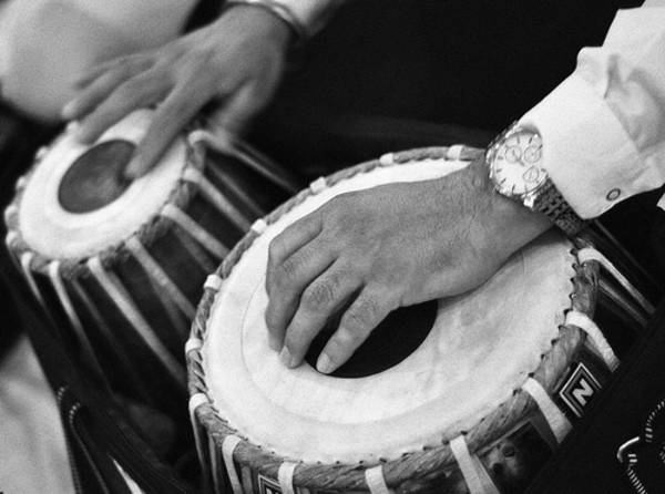 A very popular instrument for classical and popular Indian music, the tabla is a pair of drums. Each drum has a circle of black paste on the drumhead. The left-hand larger drum is usually made of metal or clay. The smaller drum on the right is wooden. The